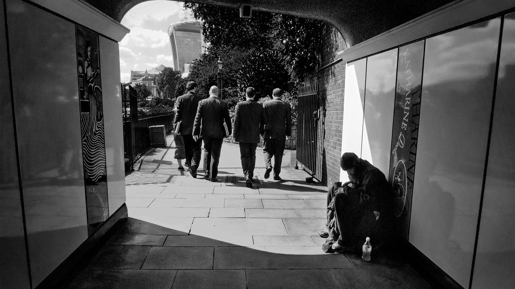 A black and white street photograph made with a compact camera or phone.