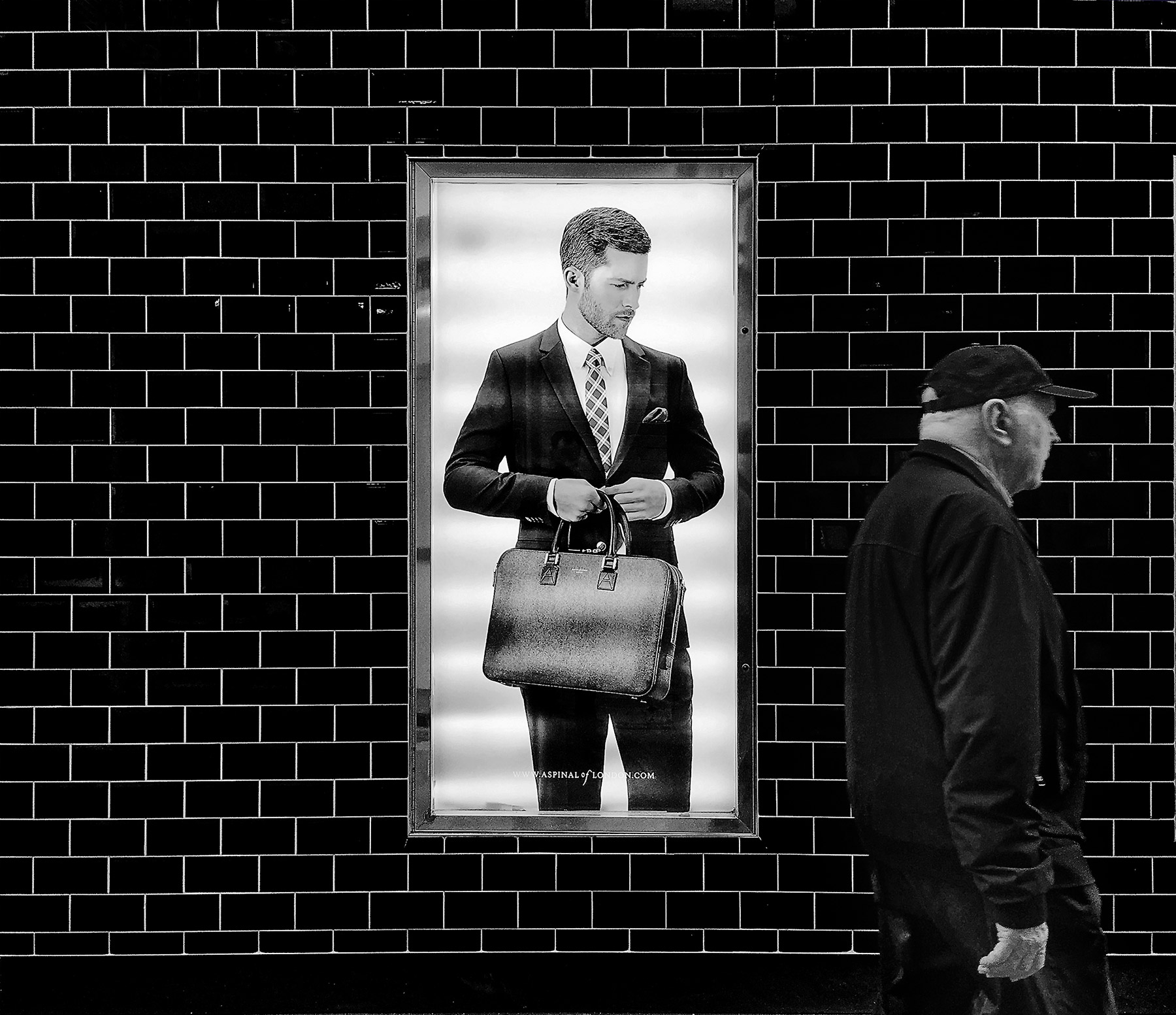 A black and white street photograph made with a compact camera or phone.