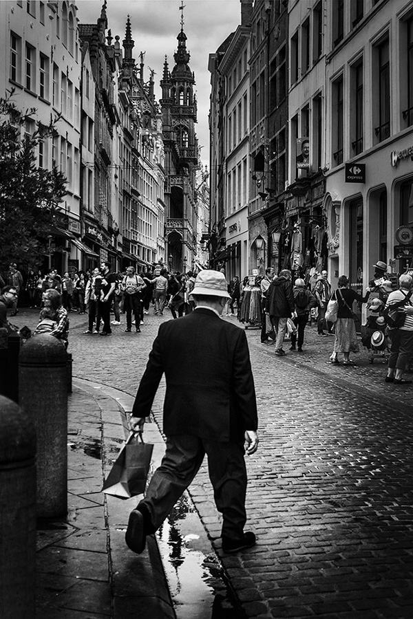 A black and white street photograph made with a compact camera or phone.