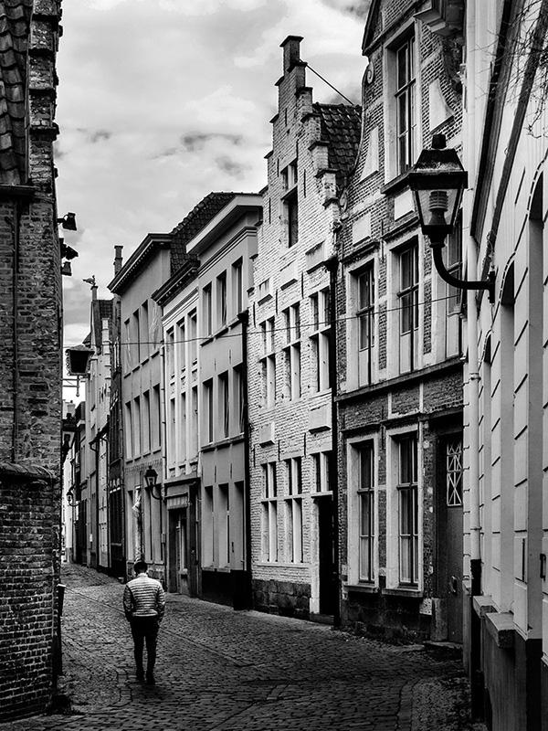 A black and white street photograph made with a compact camera or phone.