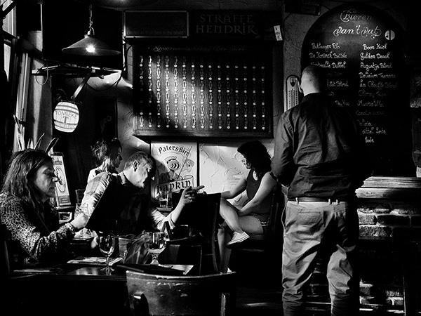 A black and white street photograph made with a compact camera or phone.