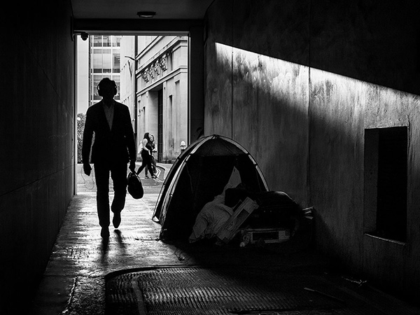A black and white street photograph made with a compact camera or phone.