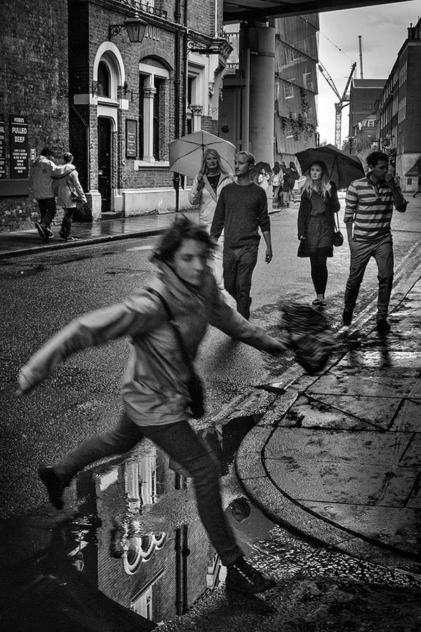 A black and white street photograph made with a compact camera or phone.