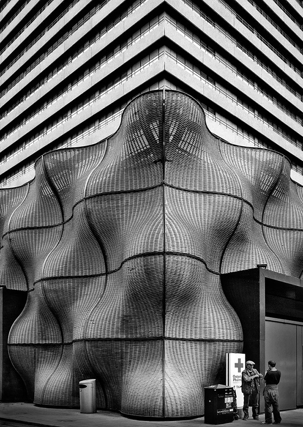 A black and white street photograph made with a compact camera or phone.