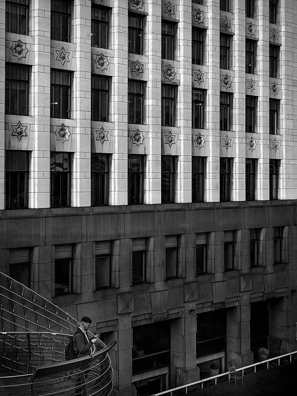 A black and white street photograph made with a compact camera or phone.