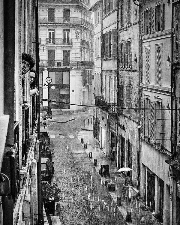A black and white street photograph made with a compact camera or phone.