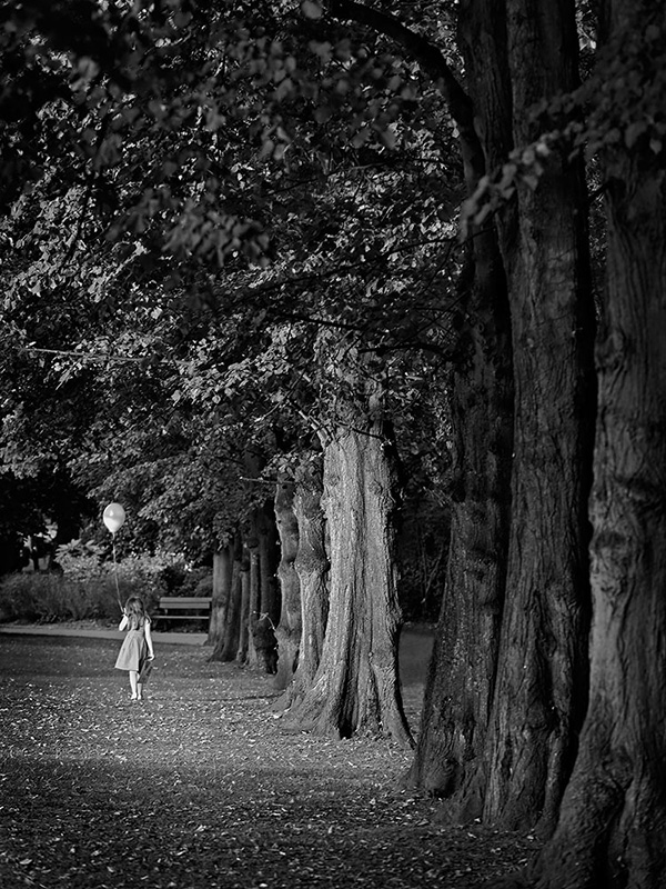 A black and white street photograph made with a compact camera or phone.