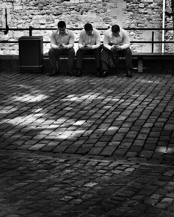 A black and white street photograph made with a compact camera or phone.