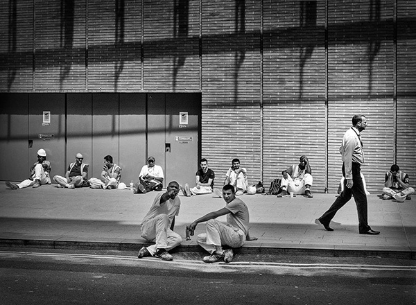 A black and white street photograph made with a compact camera or phone.