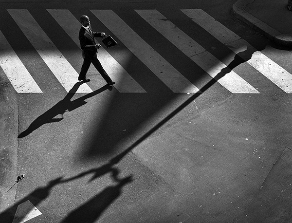 A black and white street photograph made with a compact camera or phone.