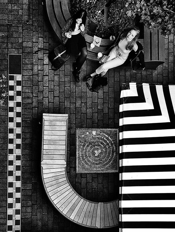 A black and white street photograph made with a compact camera or phone.