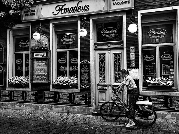A black and white street photograph made with a compact camera or phone.