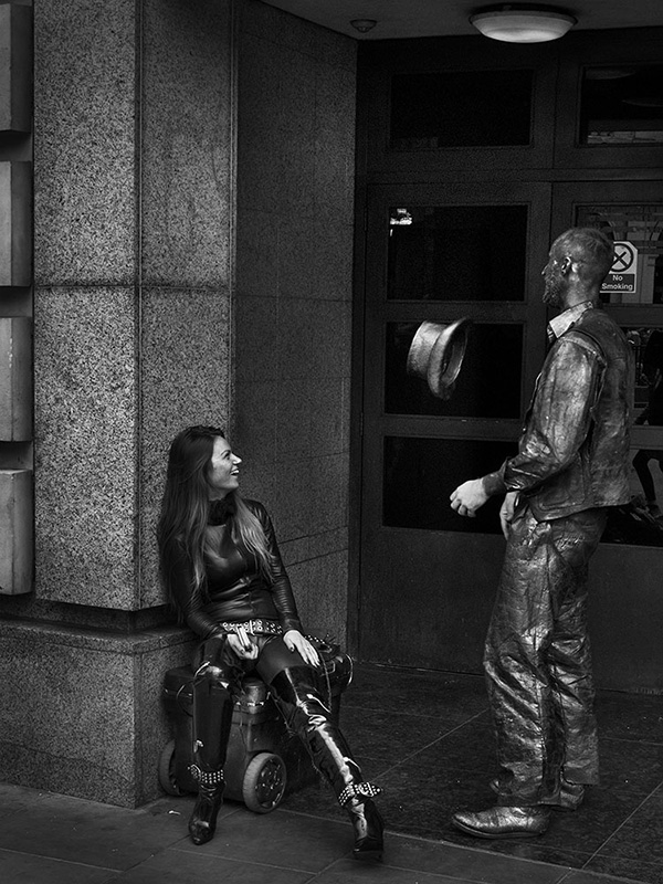 A black and white street photograph made with a compact camera or phone.