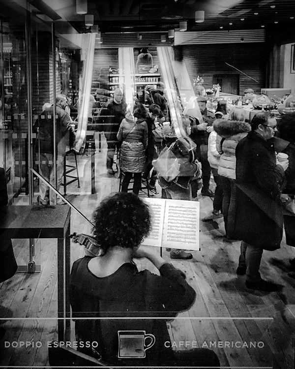 A black and white street photograph made with a compact camera or phone.