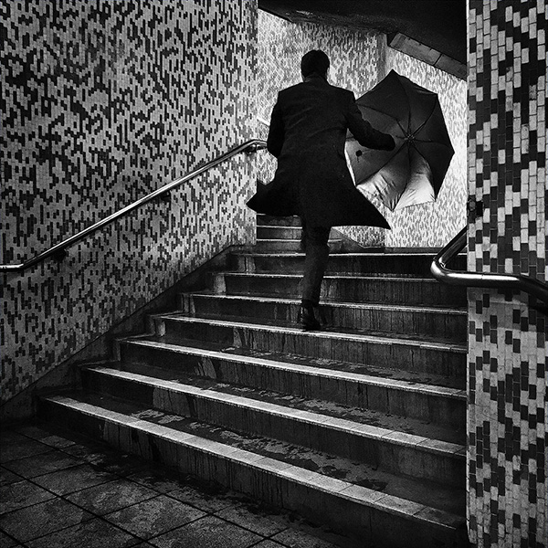 A black and white street photograph made with a compact camera or phone.