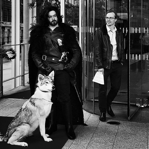 A black and white street photograph made with a compact camera or phone.