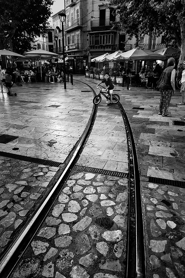 A black and white street photograph made with a compact camera or phone.